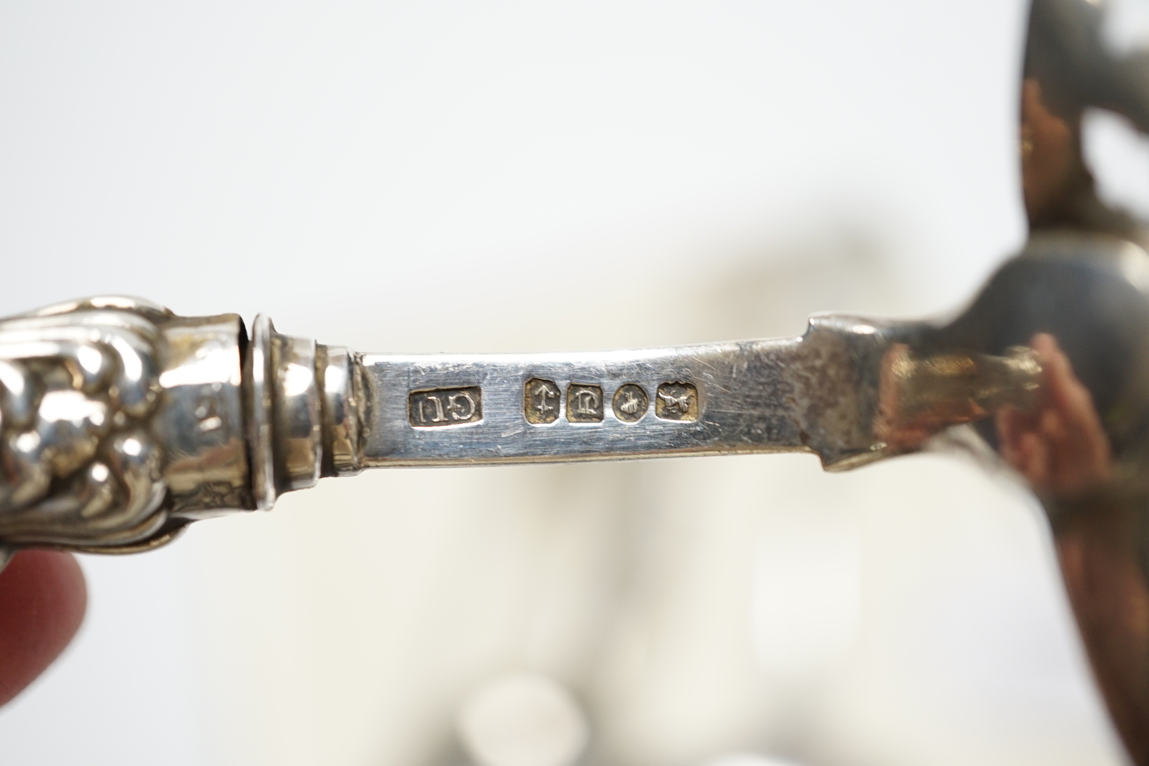 A William IV silver fiddle pattern sauce ladle, London, 1831 and six other assorted silver spoons.